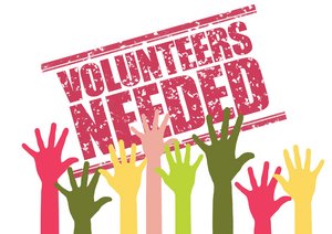 Grafik, bunte Hände recken in die Höhe vor einem Schild mit der Aufschrift  "Volunteers needed"
